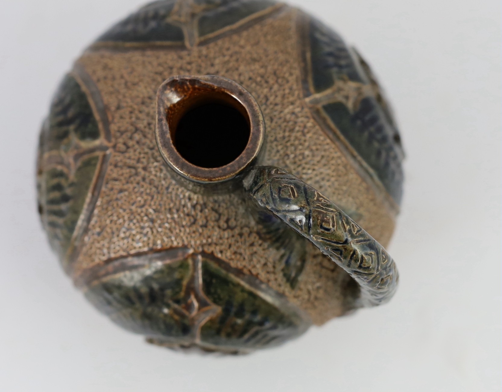 A Martin Brothers stoneware jug, c.1879, 14cm high